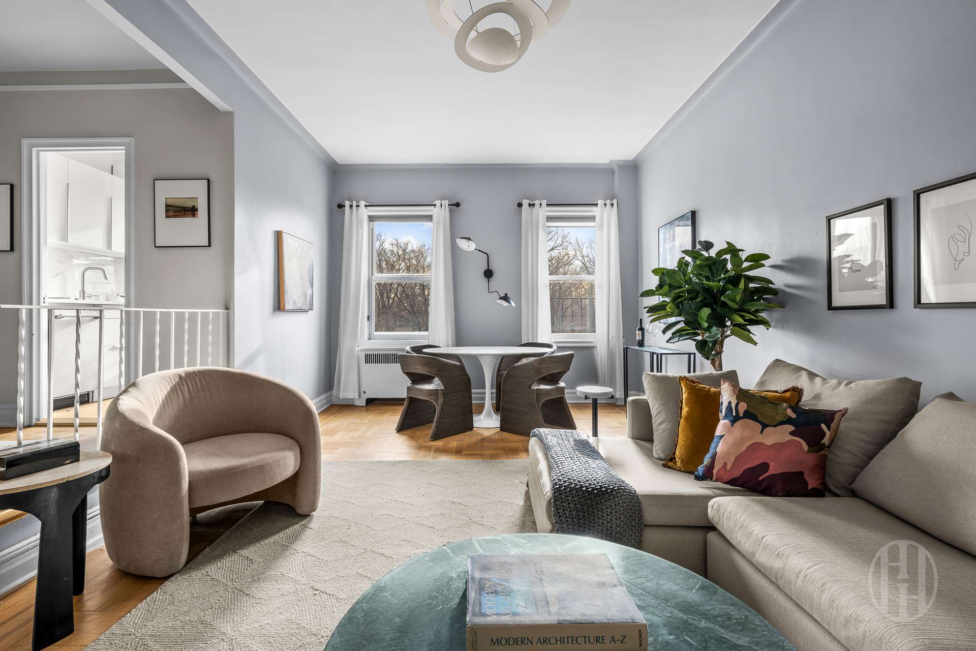 55 Eastern Parkway, Unit 6B Brooklyn, NY 11238 - Photo 1 of 9 a living room with furniture and a potted plant