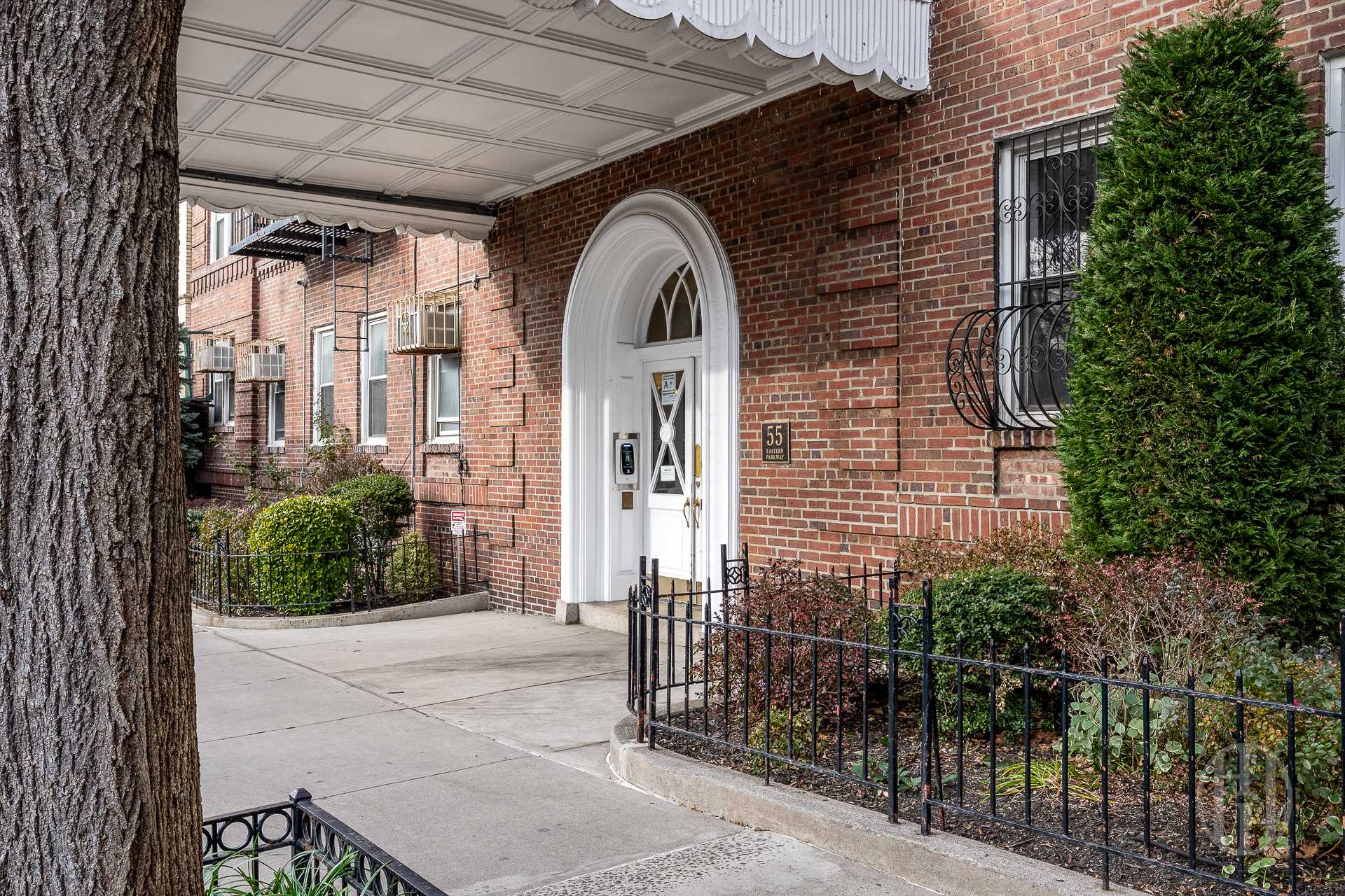 55 Eastern Parkway, Unit 6B Brooklyn, NY 11238 - Photo 8 of 9 a view of a brick house with large windows