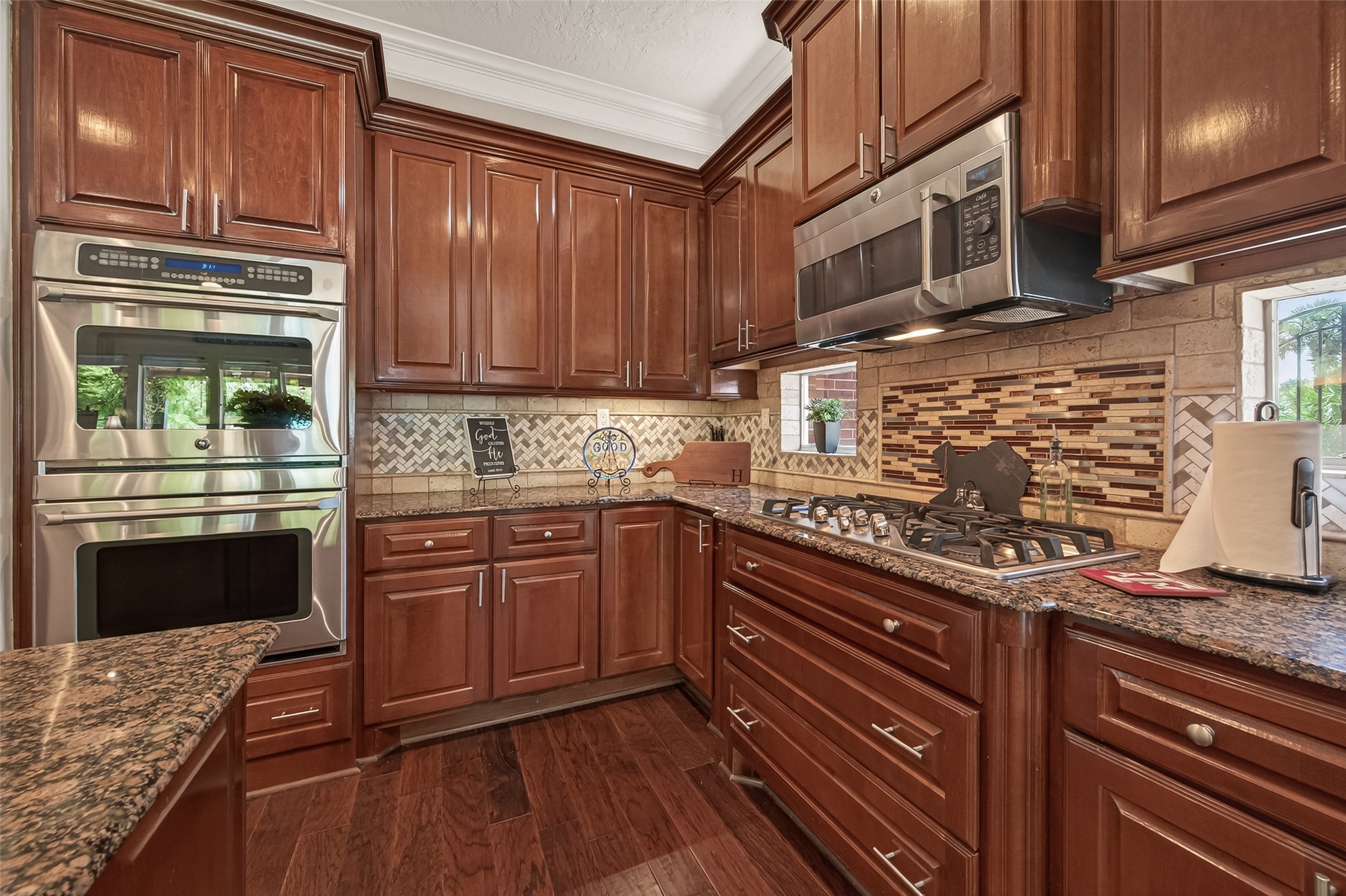 2319 Braer Ridge Drive Katy, TX 77494 - Photo 14 of 50 a kitchen with stainless steel appliances granite countertop a stove sink and cabinets