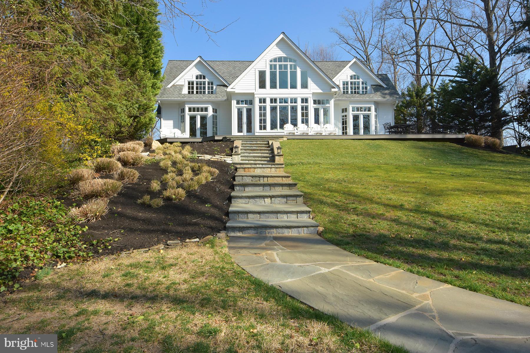 Waterside of home with stone walkways