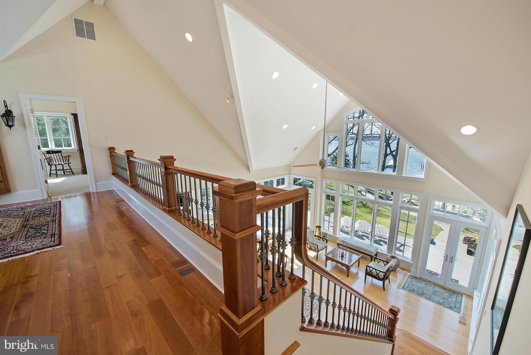 330 North Ferry Point Road Pasadena, MD 21122 - Photo 8 of 30 Custom staircase and dramatic soaring ceiling