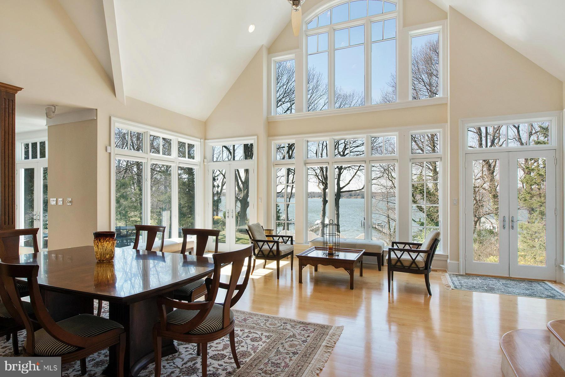 330 North Ferry Point Road Pasadena, MD 21122 - Photo 9 of 30 The great room opens to a wall of windows