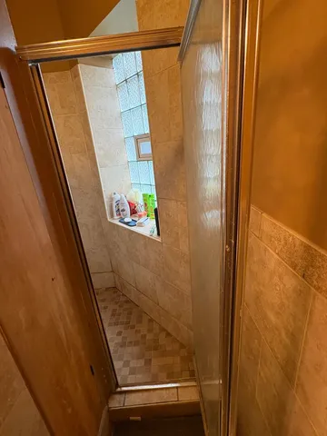 a bathroom with a sink a toilet a mirror and vanity