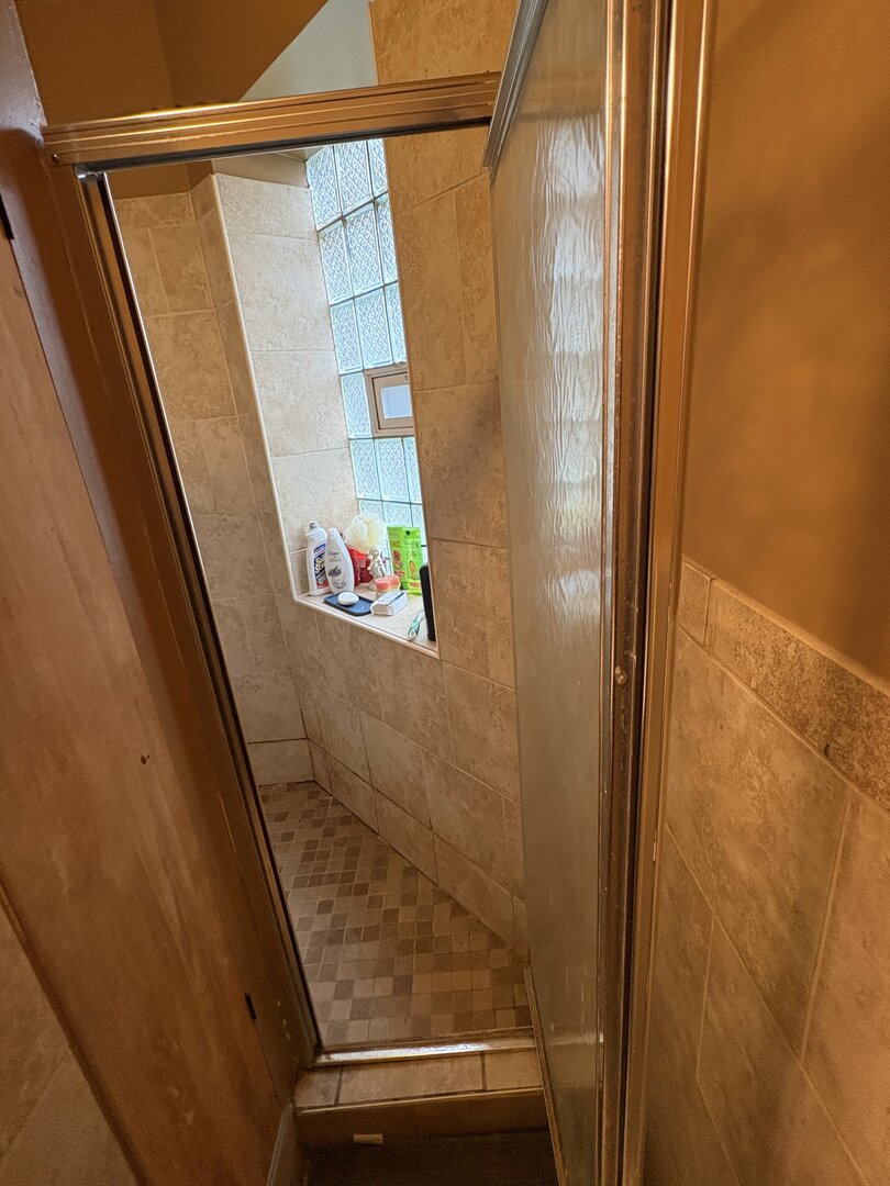 3523 North Whipple Street Chicago, IL 60618 - Photo 14 of 48 a bathroom with a shower and a sink