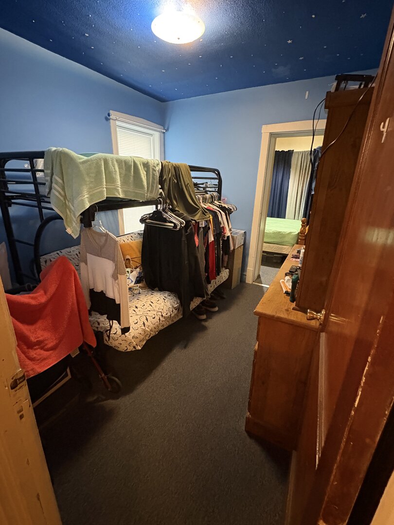 3523 North Whipple Street Chicago, IL 60618 - Photo 18 of 48 a bed room with two bed and a chair