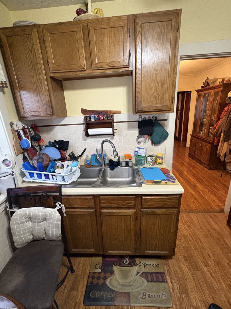 3523 North Whipple Street Chicago, IL 60618 - Photo 20 of 48 a kitchen with stainless steel appliances granite countertop a sink dishwasher and a refrigerator with wooden floor