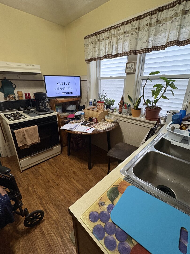 3523 North Whipple Street Chicago, IL 60618 - Photo 21 of 48 a kitchen with a sink a stove and a wooden floor