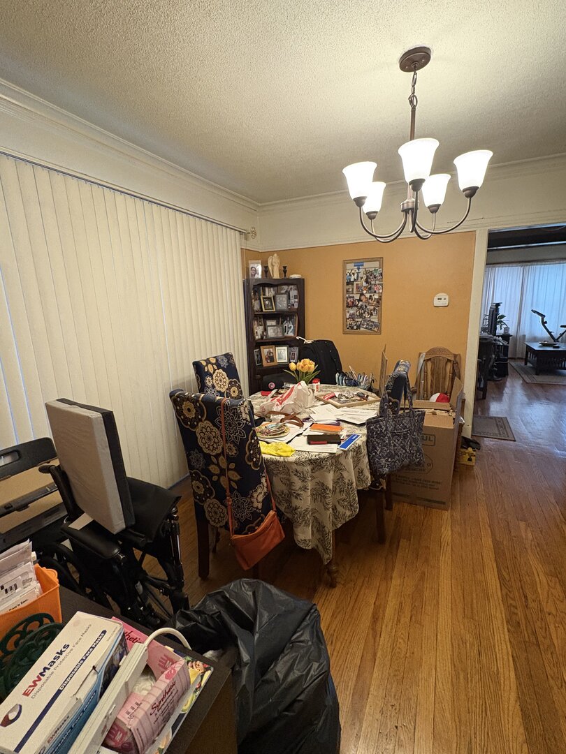 3523 North Whipple Street Chicago, IL 60618 - Photo 24 of 48 a view of a dining room with furniture a chandelier and wooden floor