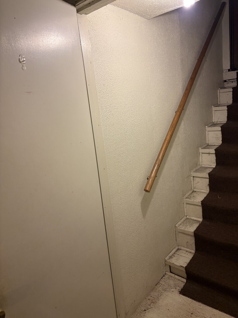 3523 North Whipple Street Chicago, IL 60618 - Photo 30 of 48 a view of staircase with wooden floor