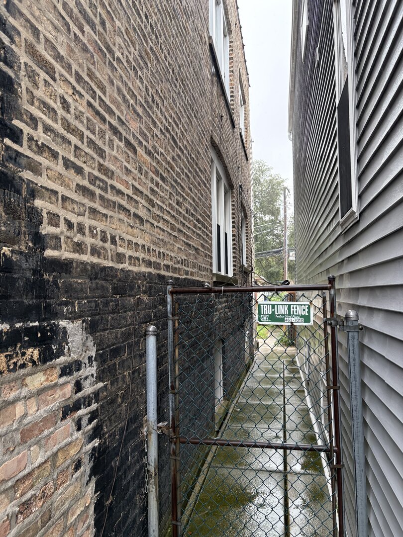 3523 North Whipple Street Chicago, IL 60618 - Photo 3 of 48 a view of a pathway both side of building