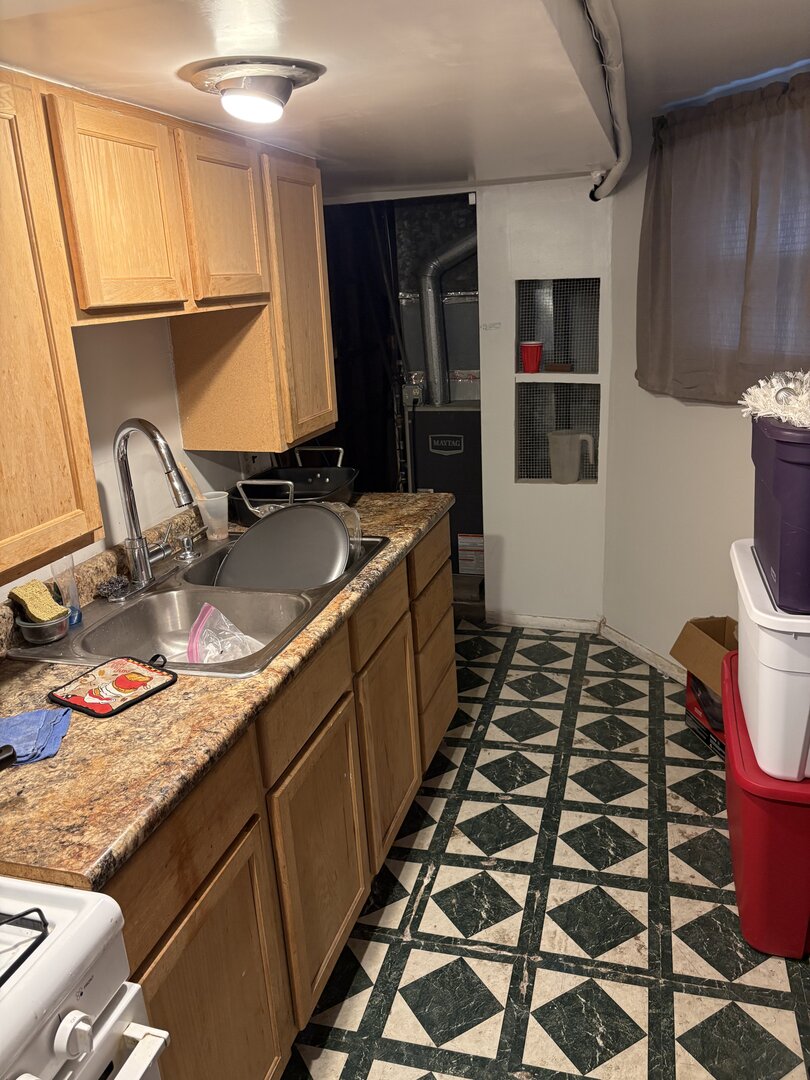 3523 North Whipple Street Chicago, IL 60618 - Photo 34 of 48 a bathroom with a granite countertop sink and a mirror