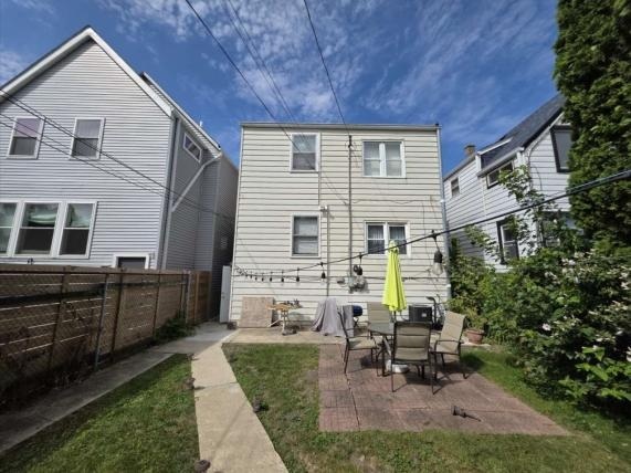 3523 North Whipple Street Chicago, IL 60618 - Photo 4 of 48 a backyard of a house with outdoor seating