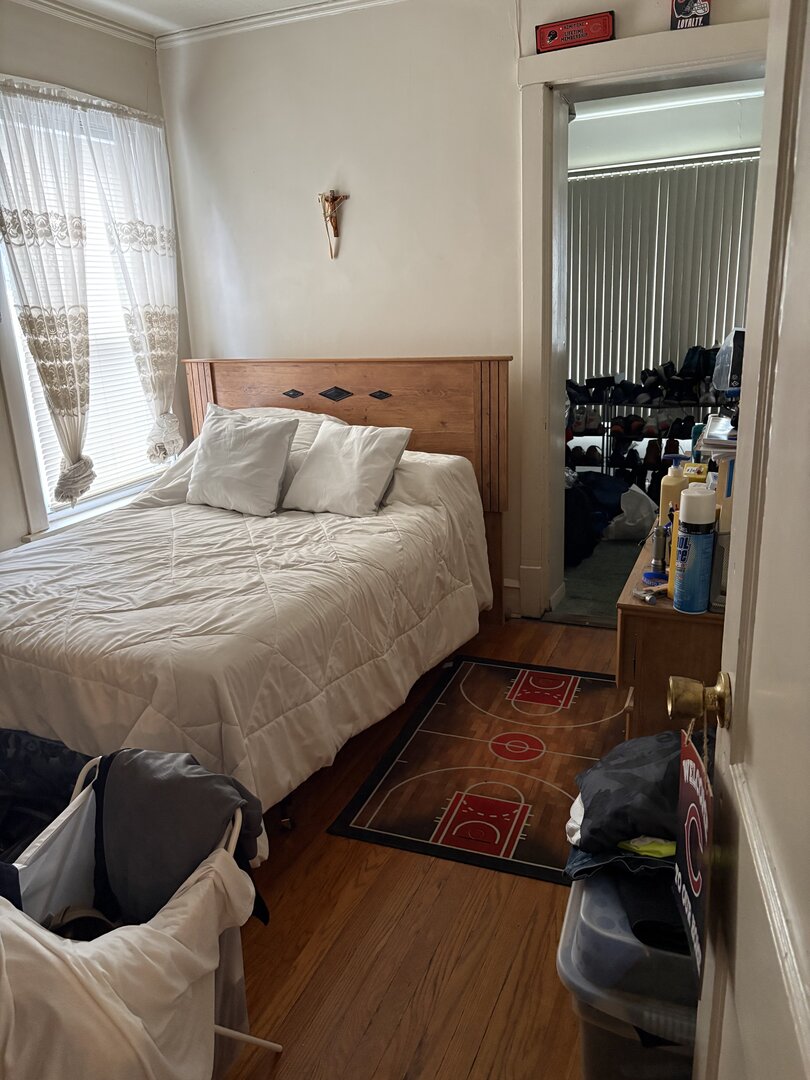 3523 North Whipple Street Chicago, IL 60618 - Photo 44 of 48 a bed sitting in a bedroom next to a window