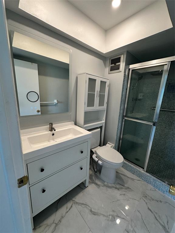 2701 East Golf Boulevard, Unit 2017 Pompano Beach, FL 33064 - Photo 3 of 26 a bathroom with a sink toilet and shower