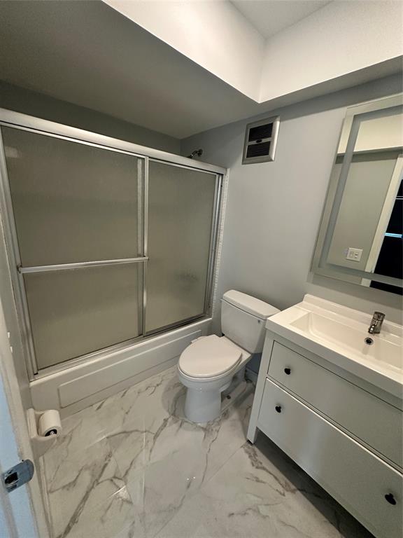 2701 East Golf Boulevard, Unit 2017 Pompano Beach, FL 33064 - Photo 5 of 26 a bathroom with a toilet and a shower