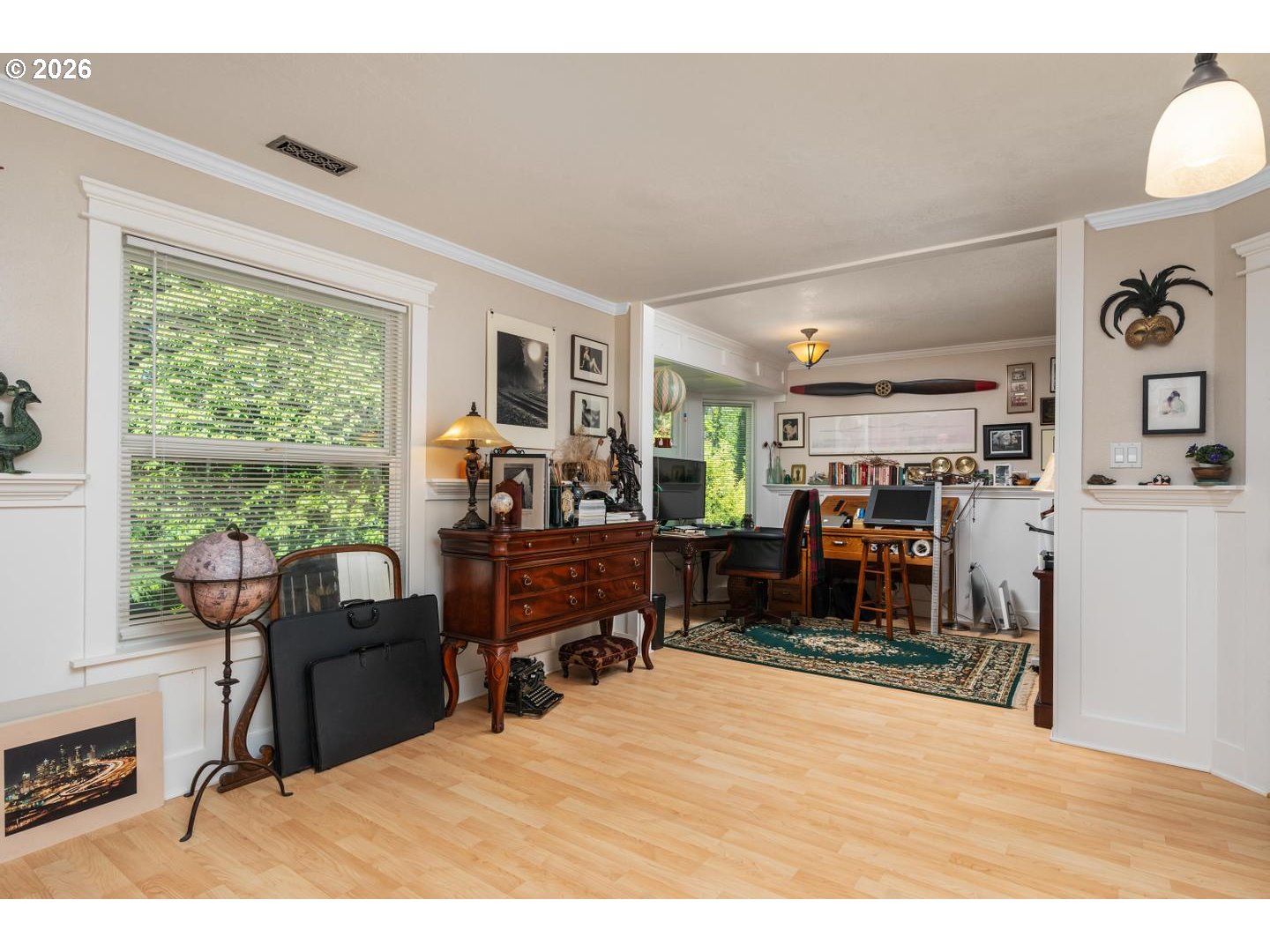 16042 Southwest Waxwing Way Beaverton, OR 97007 - Photo 27 of 48 a room with furniture a large window and a chandelier