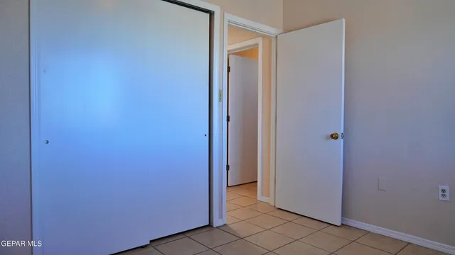 a bathroom with a granite countertop toilet and a sink