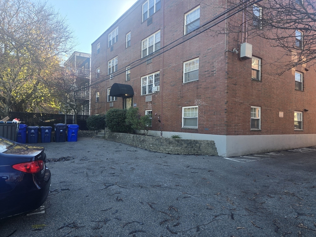 520 Talbot Avenue, Unit 9 Boston, MA 02124 - Photo 8 of 9 a view of a house with a yard