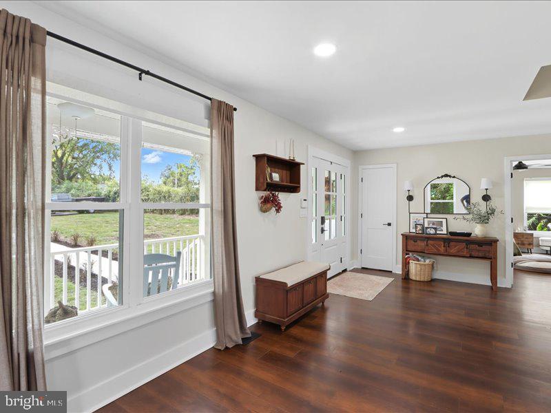 706 East Shore Road Pasadena, MD 21122 - Photo 11 of 32 a living room with furniture and a wooden floor