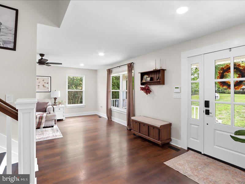 706 East Shore Road Pasadena, MD 21122 - Photo 12 of 32 a living room with furniture and a wooden floor