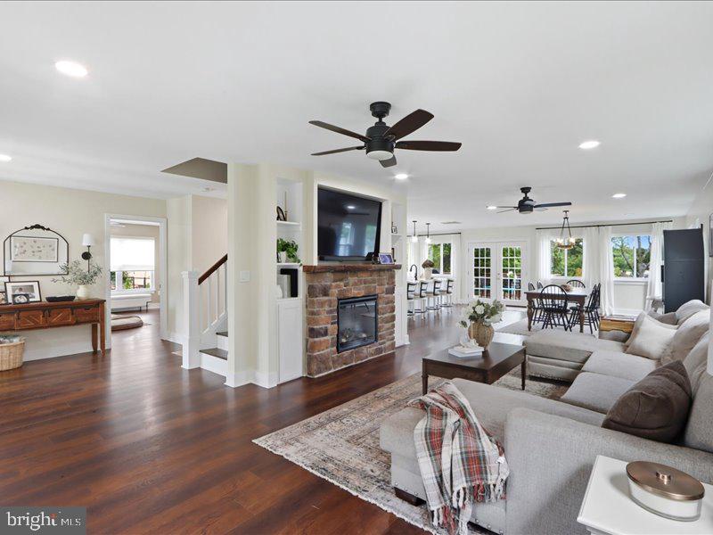 706 East Shore Road Pasadena, MD 21122 - Photo 14 of 32 a living room with fireplace furniture and a wooden floor