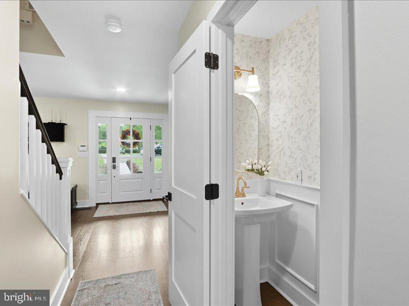 706 East Shore Road Pasadena, MD 21122 - Photo 16 of 32 a view of a hallway with wooden floor and entryway