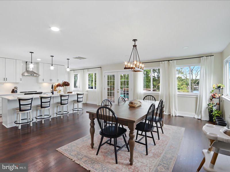 706 East Shore Road Pasadena, MD 21122 - Photo 19 of 32 a view of a dining room with furniture window and wooden floor