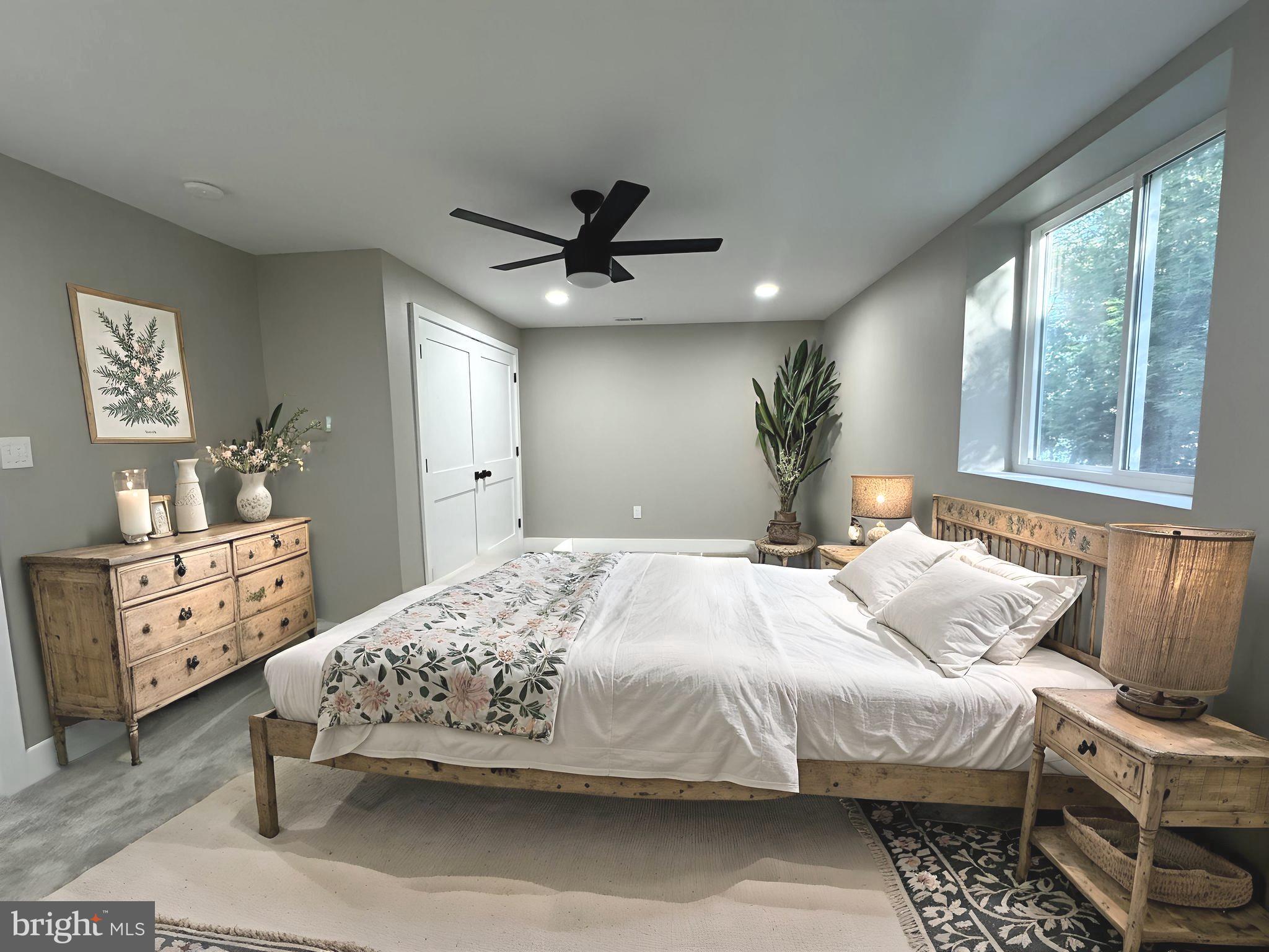 706 East Shore Road Pasadena, MD 21122 - Photo 24 of 32 a bedroom with a bed and a chandelier