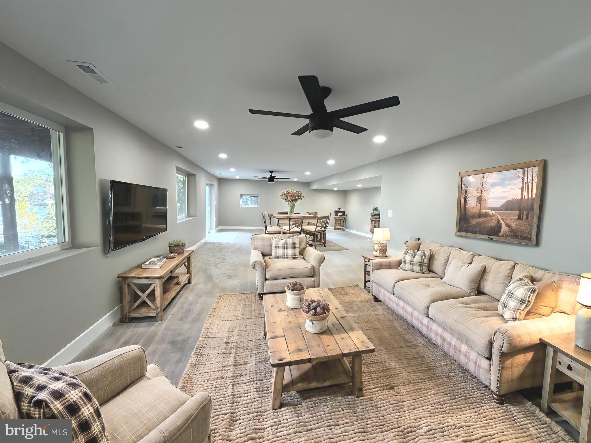 706 East Shore Road Pasadena, MD 21122 - Photo 25 of 32 a living room with furniture and a flat screen tv