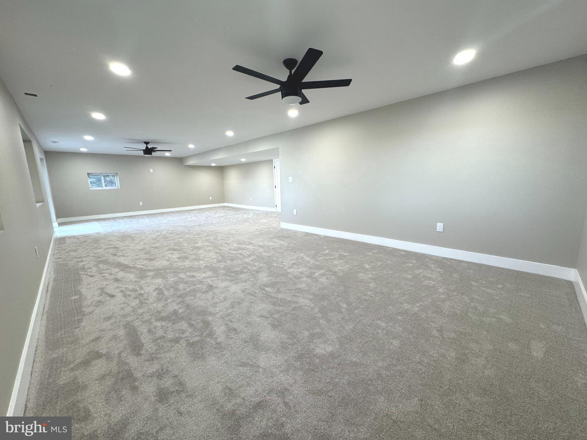706 East Shore Road Pasadena, MD 21122 - Photo 26 of 32 an empty room with a ceiling fan and window