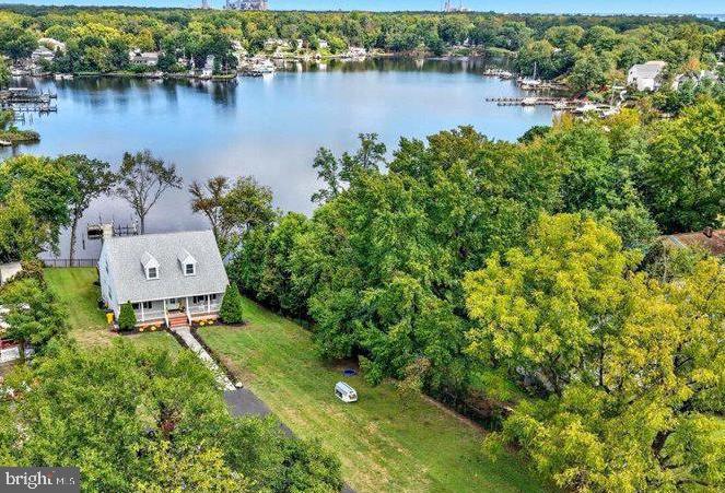 706 East Shore Road Pasadena, MD 21122 - Photo 31 of 32 an aerial view of a house with a yard and lake view