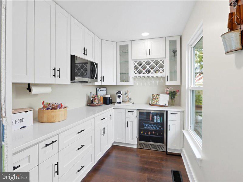 706 East Shore Road Pasadena, MD 21122 - Photo 7 of 32 a kitchen with stainless steel appliances white cabinets sink and window