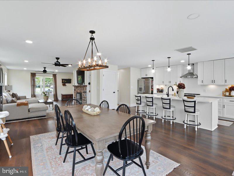 706 East Shore Road Pasadena, MD 21122 - Photo 8 of 32 a view of a dining room with furniture and wooden floor