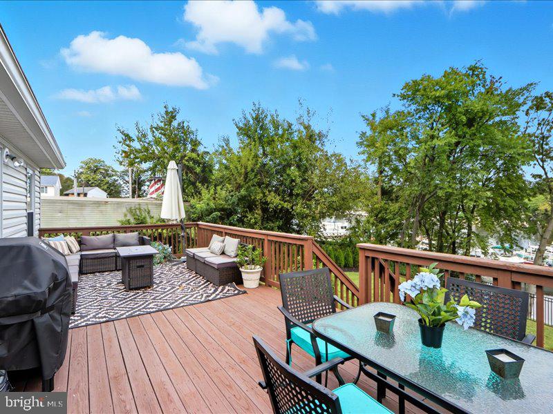 706 East Shore Road Pasadena, MD 21122 - Photo 9 of 32 a view of deck with patio