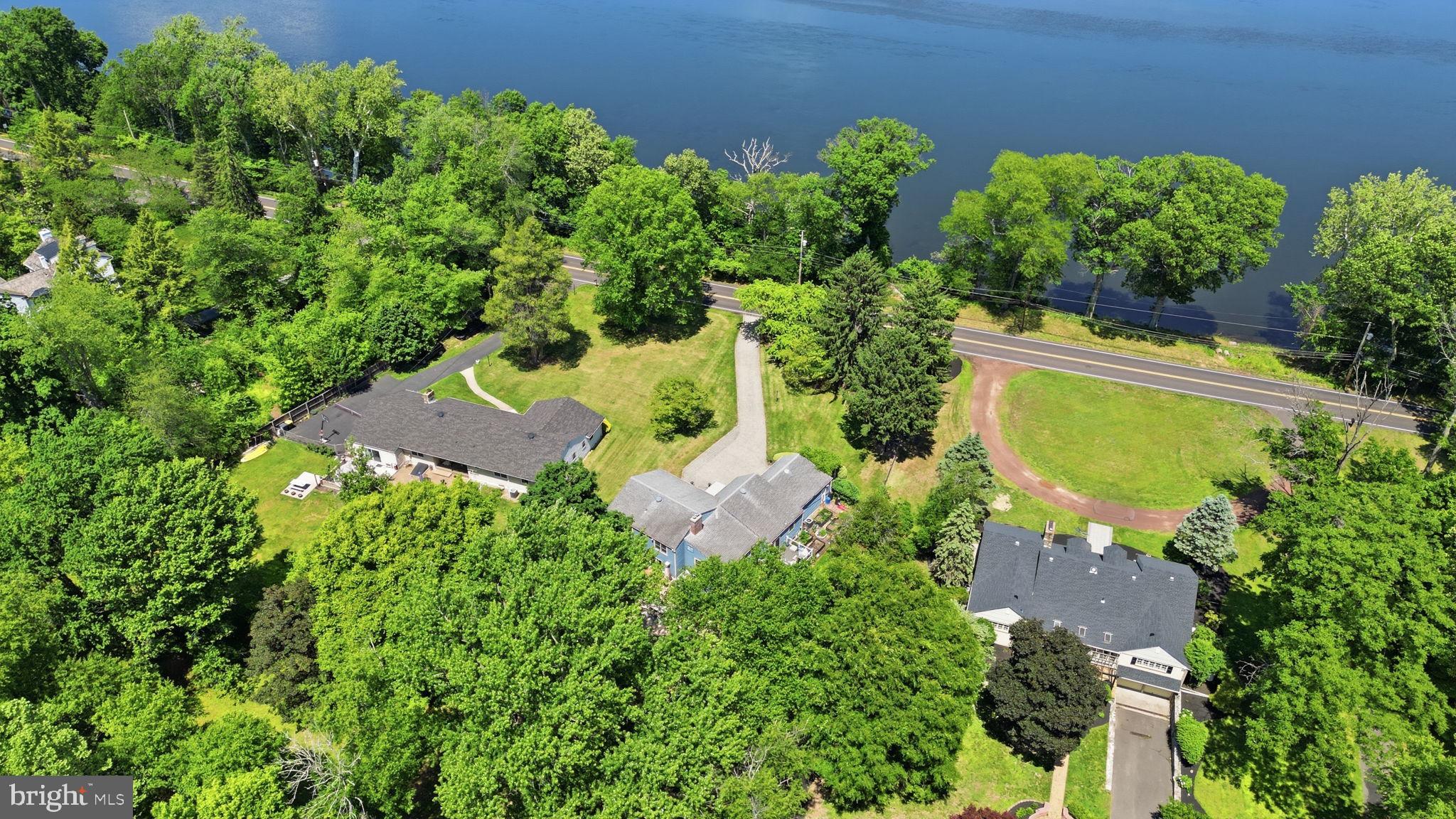 621 River Road Yardley, PA 19067 - Photo 2 of 75 an aerial view of a house with a yard and garden