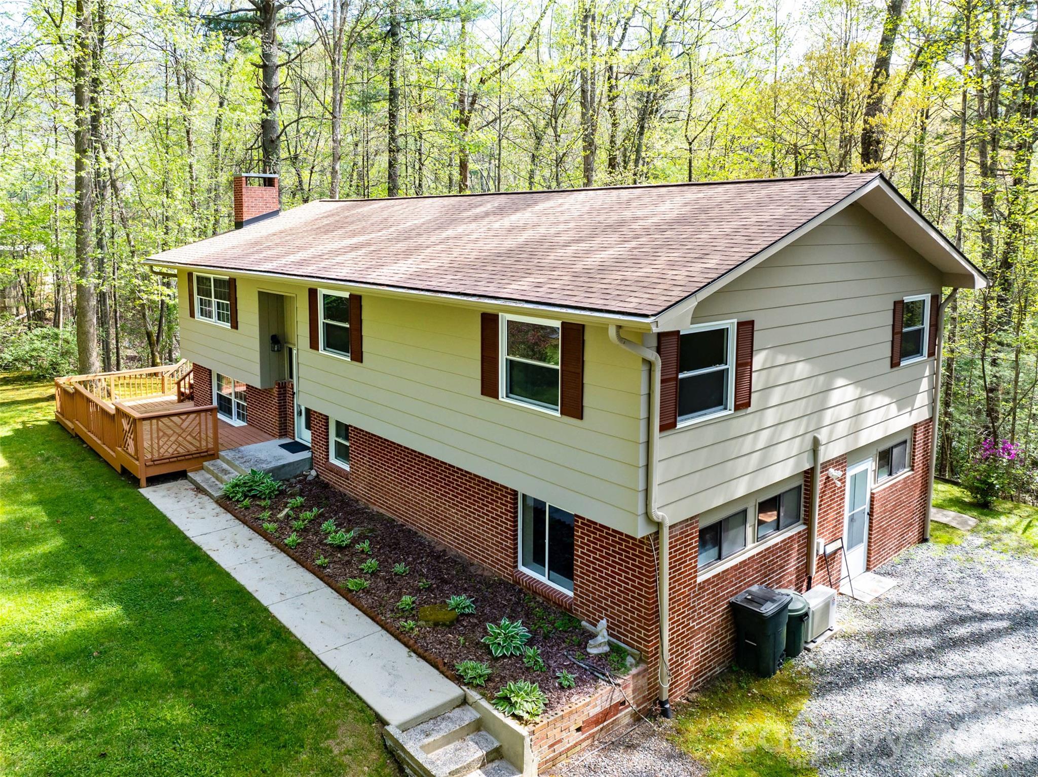 145 Jeter Mountain Road Hendersonville, NC 28739 - Photo 3 of 13 a view of a house with a yard