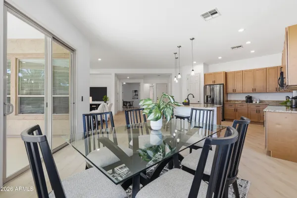 a view of a dining room with furniture window and outside view