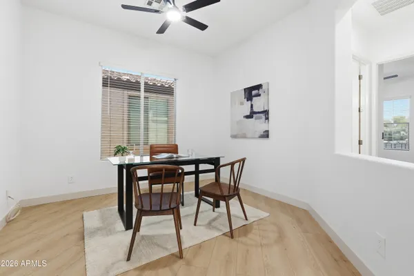 a view of a dining room with furniture and window