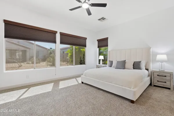 a view of a dining room with furniture and window