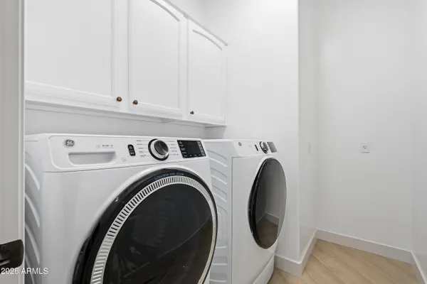 a bathroom with a sink mirror toilet and bathtub