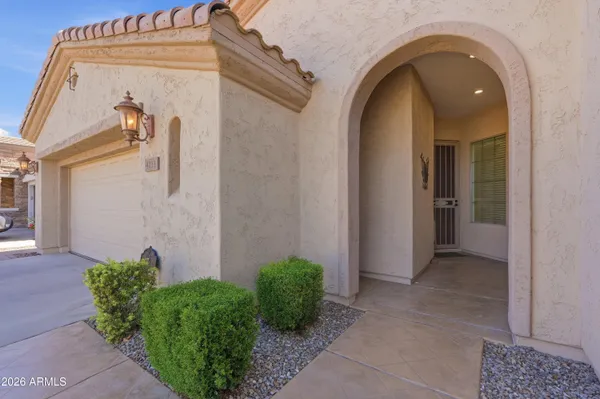 a view of a house with potted plants