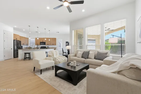 a living room with furniture and a large window