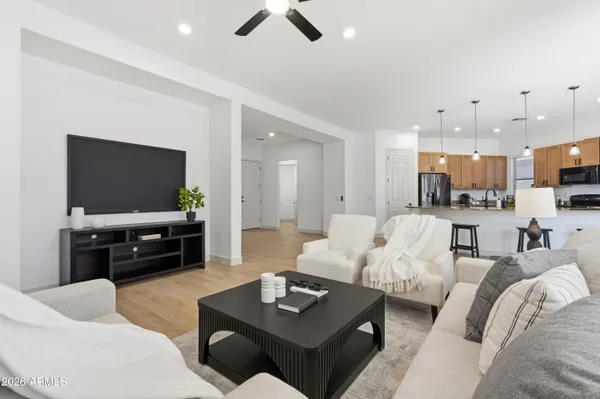 a living room with furniture and a large window