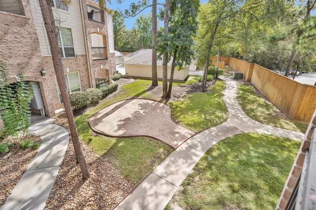 a view of a balcony with a floor to ceiling window