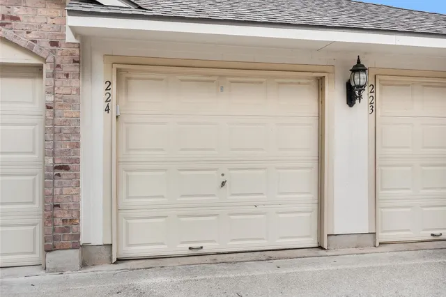 a view of a house with a yard and garage