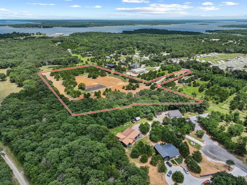 1445 Cedar Mills Road Gordonville, TX 76245 - Photo 5 of 28 Expansive acreage bordered by mature trees and featuring a partial clearing