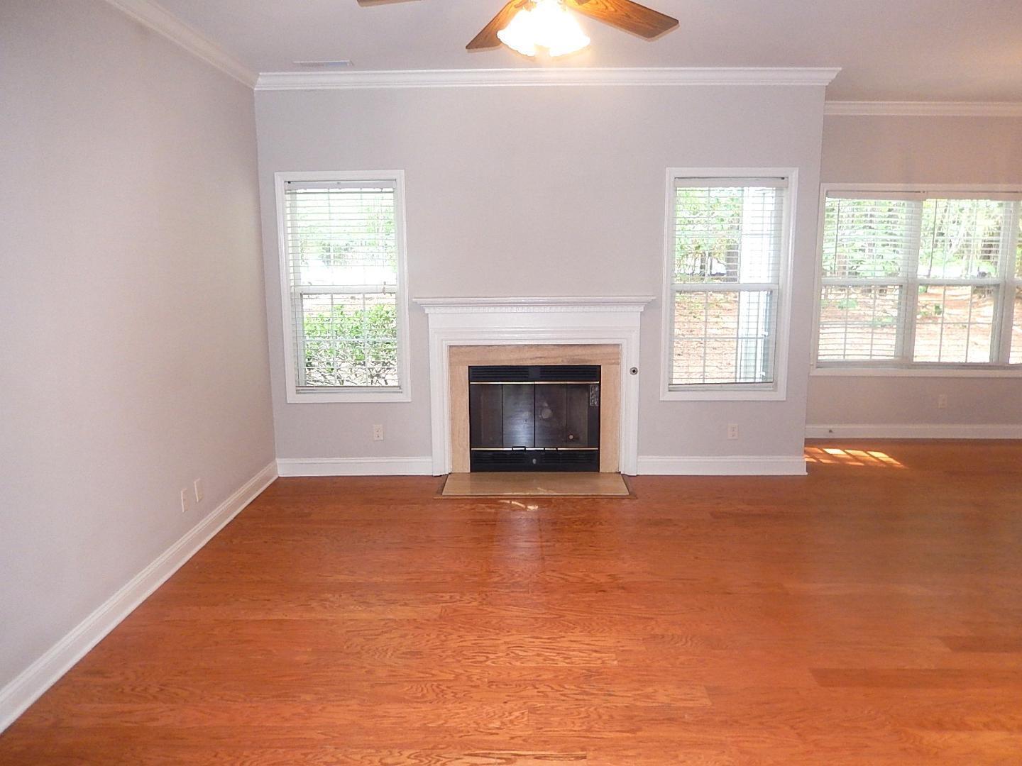 211 Bridgepath Drive Cary, NC 27513 - Photo 5 of 26 an empty room with windows and fireplace