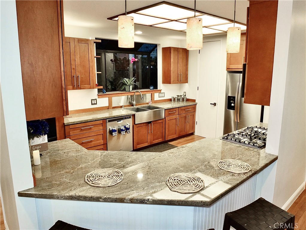 341 S Meadows Manhattan Beach, CA 90266 - Photo 18 of 54 a living room with granite countertop furniture and fireplace