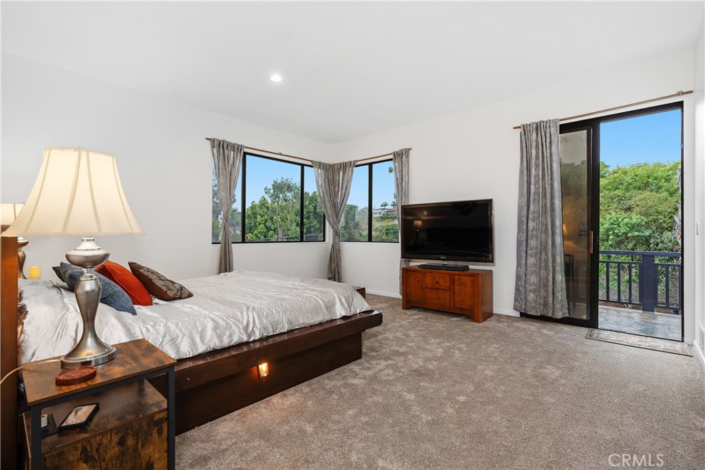 341 S Meadows Manhattan Beach, CA 90266 - Photo 29 of 54 a bedroom with a bed and flat screen tv