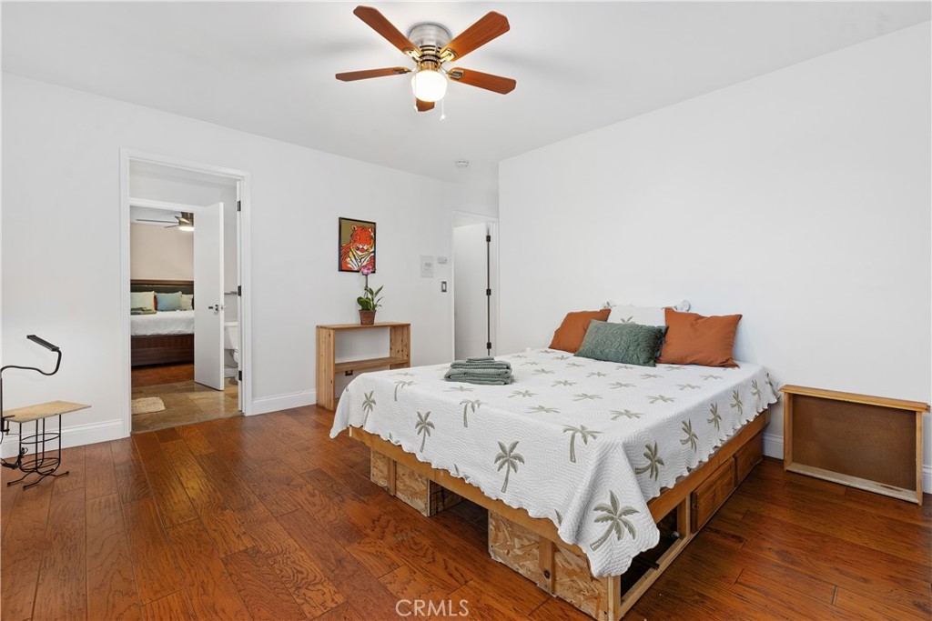 341 S Meadows Manhattan Beach, CA 90266 - Photo 37 of 54 a spacious bedroom with a bed and wooden floor